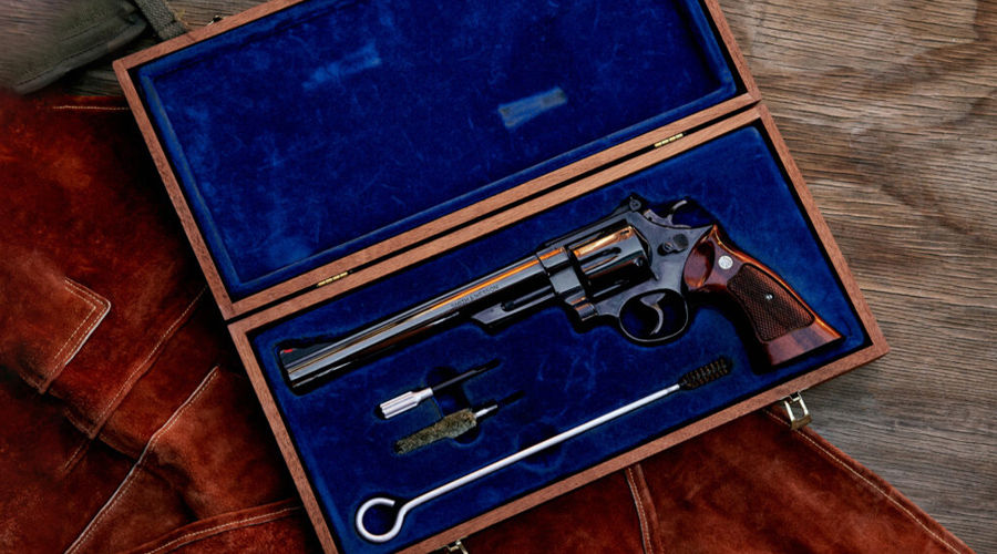 A gun that is in the box with some other items